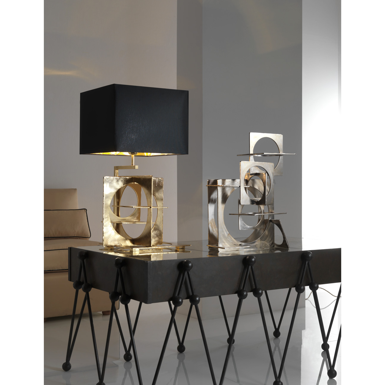 Table lamp in hand emery and engraved steel, aged gold finish. Black
chintz lampshade with golden inside.